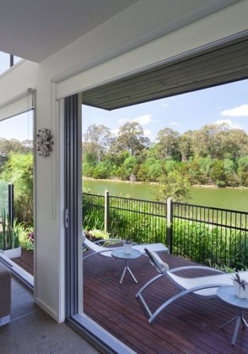 14018637_m In the above room, streamlined roller blinds which “disappear” against plain walls provide practical solution without detracting from the view.