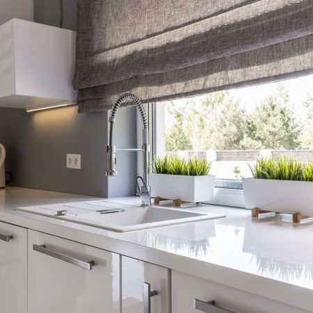 60709505 - image of high gloss white modern kitchen with window roller blinds 60709505 - image of high gloss white modern kitchen with window roller blinds